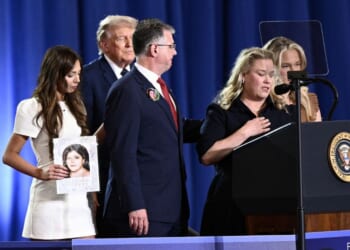 President Donald Trump listens as Jessica Gorman, mother of Sheridan Gorman, speaks during an event on the economy at Rockland Community College Fieldhouse in Suffern, New York, on May 22, 2026.