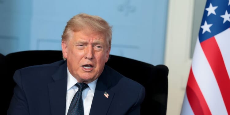 President Donald Trump talks as he meets French President Emmanuel Macron for a bilateral meeting at Hotel Royal Evian on June 15, 2026, in Évian-les-Bains, France.