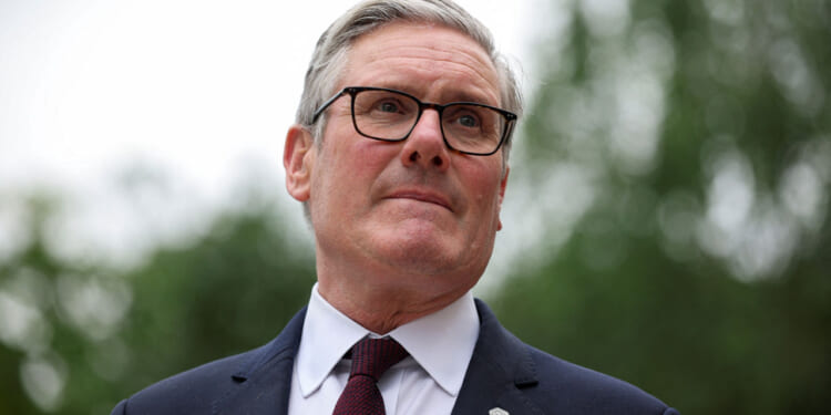 Close-up of UK Prime Minister Keir Starmer with pursed lips.