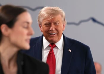 President Donald Trump chuckles after cracking a joke about being "the boss" as he arrives for a working session on promoting economic growth with G7 leaders and G7 outreach partners Wednesday in Evian-les-Bains, France.