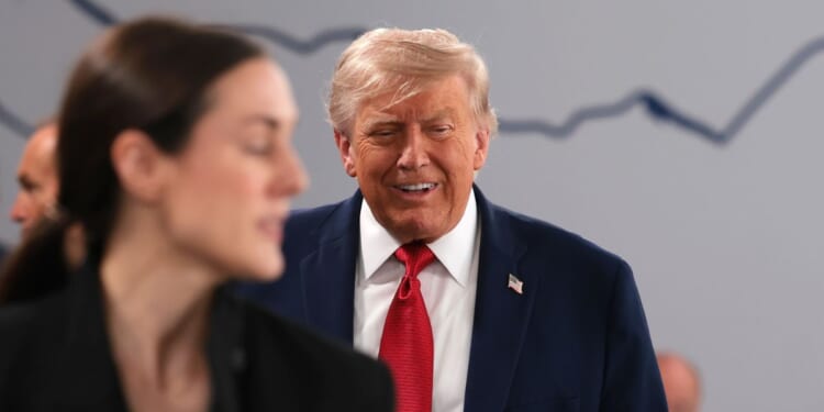 President Donald Trump chuckles after cracking a joke about being "the boss" as he arrives for a working session on promoting economic growth with G7 leaders and G7 outreach partners Wednesday in Evian-les-Bains, France.