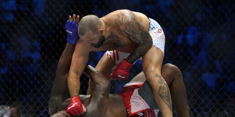 Josh Hokit of the United States lands a punch on Derrick Lewis of the United States during UFC Freedom 250 at the White House on June 14, 2026, in Washington, D.C.