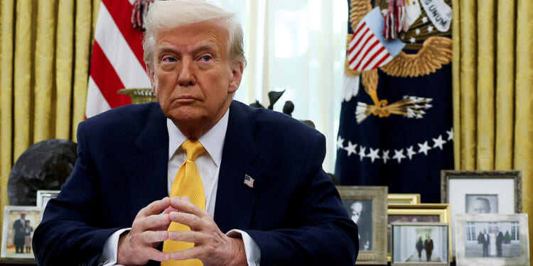 President Donald Trump sits in the Oval Office of the White House in Washington, D.C., March 7, 2025. REUTERS/Leah Millis