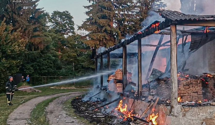 In this photo, provided by the Ukrainian Emergency Service, firefighters extinguish a fire in a residential building following a Russian drone attack in Sumy region, Ukraine, Friday, June 26, 2026. (Ukrainian Emergency Service via AP)
