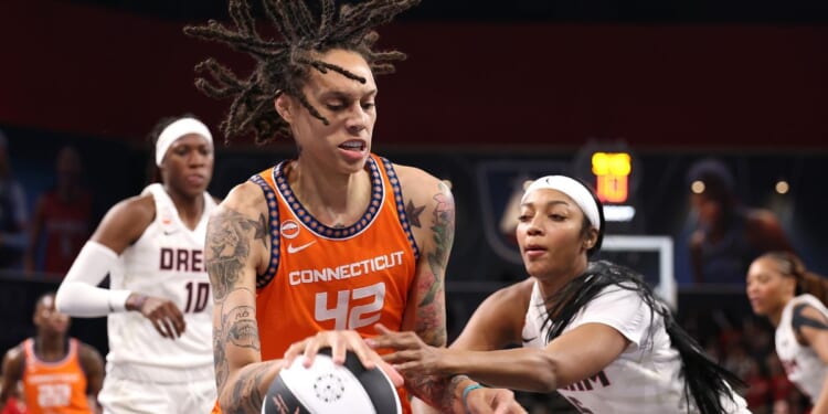 Brittney Griner of the Connecticut Sun drives against Angel Reese of the Atlanta Dream during the first quarter at Gateway Center Arena on June 2, 2026, in College Park, Georgia.