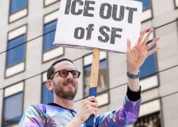 Sen. Scott Weiner waves to onlookers on June 29, 2025, during the "gay pride" parade in San Francisco, California.