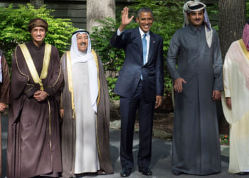 Barack Obama waves alongside delegation leaders following the Gulf Cooperation Council-U.S. summit.