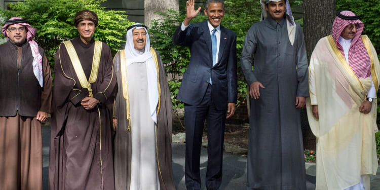 Barack Obama waves alongside delegation leaders following the Gulf Cooperation Council-U.S. summit.