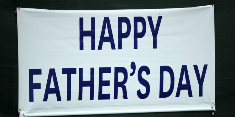 Happy Father's Day sign is seen during the final round of the 2019 U.S. Open at Pebble Beach Golf Links on June 16, 2019 in Pebble Beach, California. (Photo by Andrew Redington/Getty Images)