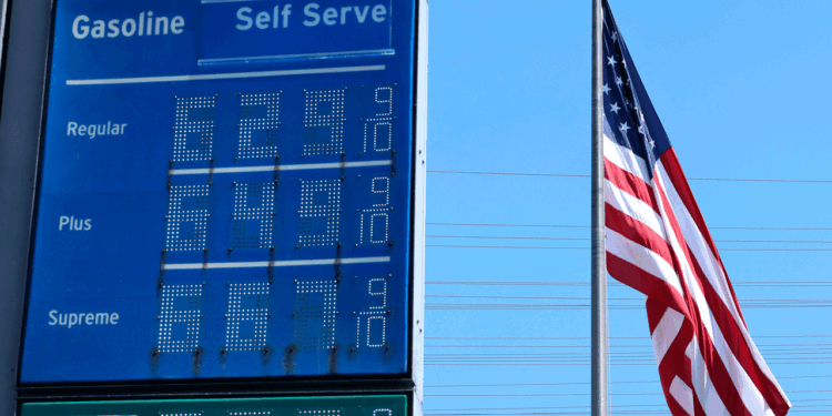 Six-dollar gas is displayed at a California gas station with the American flag in the background.