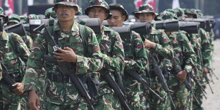 Indonesian troops recover body of U.S. pilot slain by rebels in West Papua