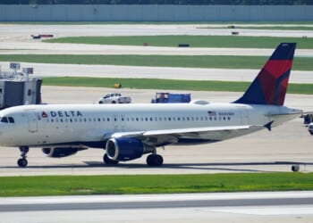 A Delta Air Lines plane taxies on the runway after landing at Chicago Midway International Airport on Aug. 2, 2023.