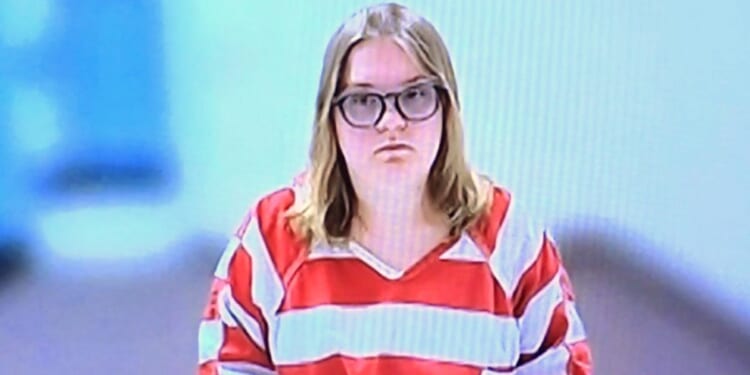 An Idaho mother who said her toddler twins died after vaccinations has been charged with murder