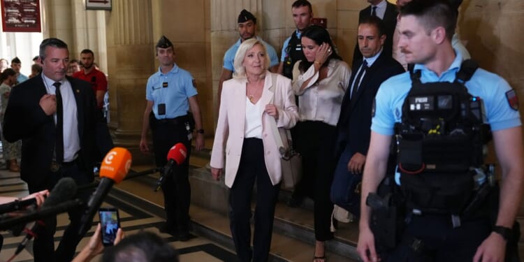 Le Pen says she’ll run for French presidency next year despite court-ordered monitor