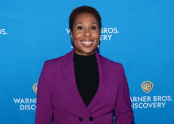 “CNN This Morning” host Audie Cornish stands at a red carpet in a purple pantsuit on May 15, 2025.
