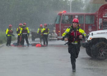 Texas flooding surges from huge rainstorms as rescuers pull people from rising waters