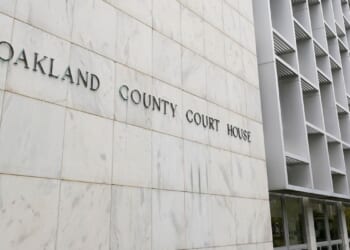Michigan woman pleads no contest to abuse after 3 kids are found living alone for years