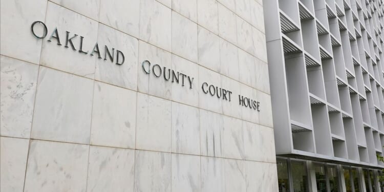 Michigan woman pleads no contest to abuse after 3 kids are found living alone for years