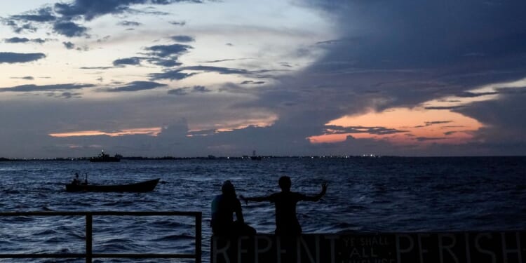 A ferry carrying 116 people capsizes off Guyana, with 67 rescued as search continues