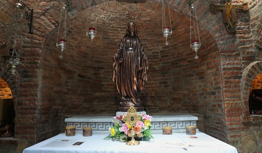 A statue of Mary modeled after the one in Turkey, alongside a relic said to be from her veil inside the Ephesus House, a replica of the House of the Virgin Mary in Ephesus, Turkey, at Alfonso town, Cavite province, Philippines on July 16, 2026. (AP Photo/Aaron Favila)