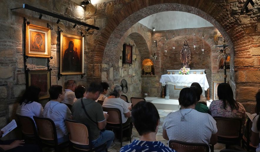Visitors pray inside the Ephesus House, a replica of the House of the Virgin Mary in Ephesus, Turkey, at Alfonso town, Cavite province, Philippines on July 16, 2026. (AP Photo/Aaron Favila)