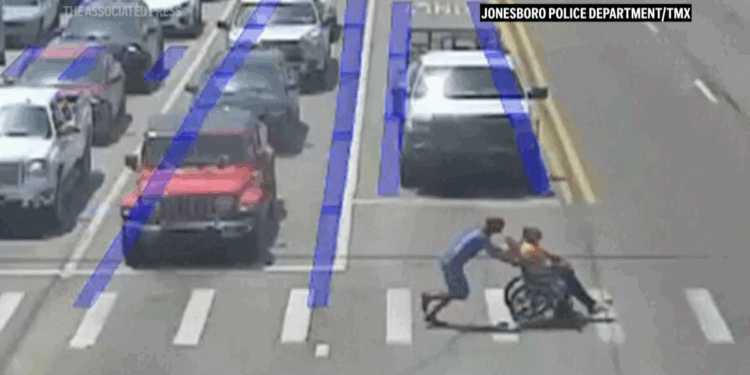 Spider-Man moonlights as good Samaritan, guides man in wheelchair across long crosswalk in Arkansas