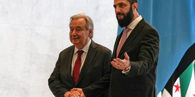 The U.N. chief on a visit to Damascus urges the international community to support Syrian people