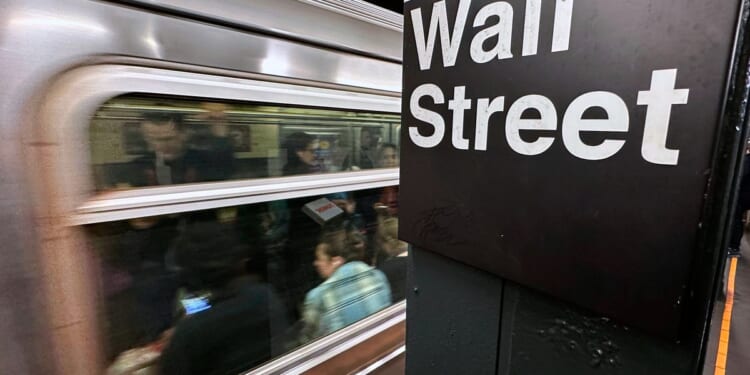 Stocks waver on Wall Street and crude oil prices drop 5% as Mideast tensions cool