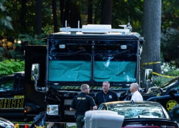Officials say man killed wife and 6 kids, then himself, before all were found in Michigan home fire