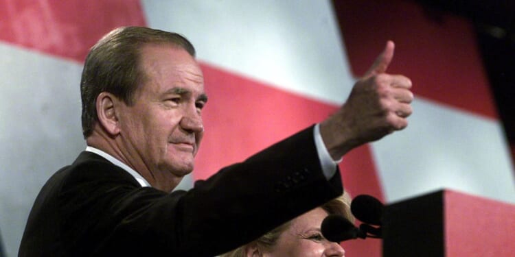 Reform Party presidential candidate Pat Buchanan, flanked by his wife Shelly, gives the thumbs-up to supporters after his Aug. 12, 2000, speech at the Reform Party National Convention in Long Beach, California.