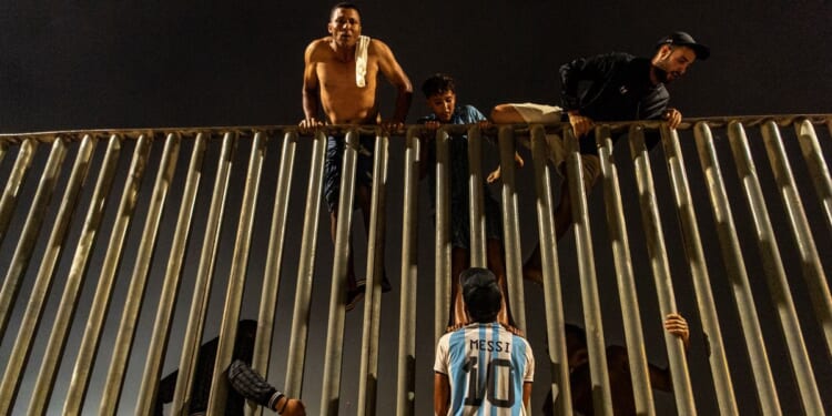 At least 18 die after thousands breach border between Morocco and Spanish territory of Ceuta
