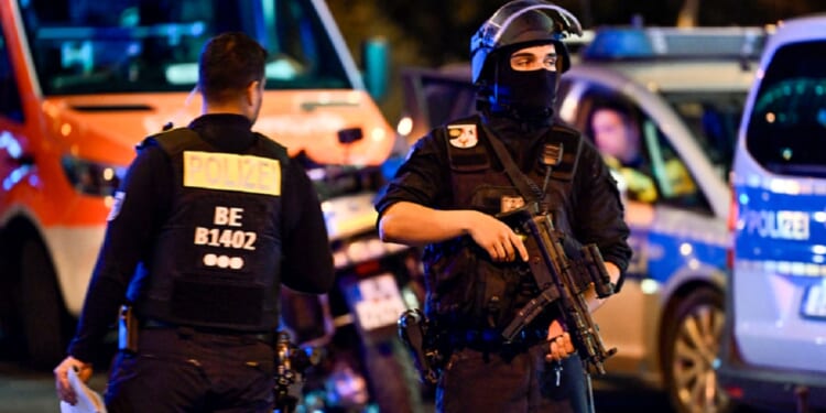Berlin police on the scene of an Islamist attack on Saturday that killed on participant in a "gay pride" parade and left 29 wounded. The attacker was killed by police on Sunday.