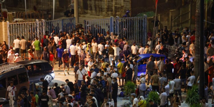 People gather at Bab Sebta on the Morocco-Spain border near Spain's enclave of Ceuta and the Moroccan town of Fnideq, on July 30, 2026.