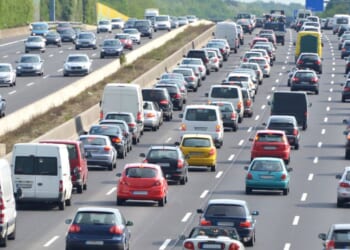 A traffic jam on a four-lane highway at rush hour.