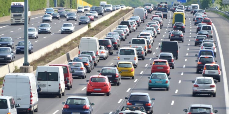 A traffic jam on a four-lane highway at rush hour.