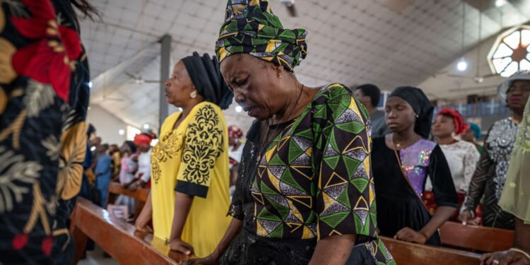 Catholic Nigerians pray in Saint Michael's Cathedral during a Sunday service in Minna, Nigeria on Nov. 30, 2025.