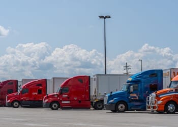 Semi-trucks parked in a lot at rest stop on the Pennsylvania Turnpike in Somerset, Pennsylvania, on July 23, 2023.