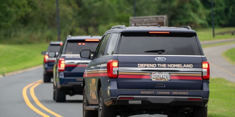 Immigration and Customs Enforcement agents in newly designed vehicles arrive ahead of a scheduled speech by President Donald Trump at the Park Police Anacostia Operating Facility on Aug. 21, 2025, in Washington, D.C.