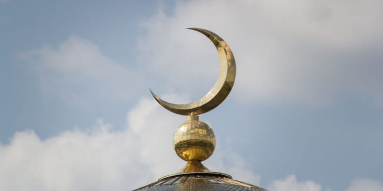 The Islamic crescent on a mosque.