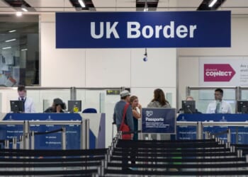 A line in front of the UK Border Force checkpoint at Gatwick Airport on May 28, 2014 in London.