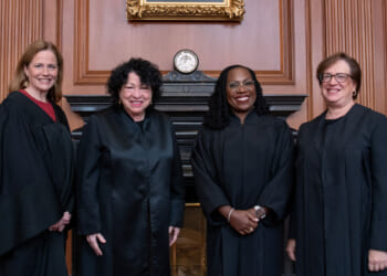 The four female justices pose together, from left to right, Amy Coney Barrett, Sonia Sotomayor, Ketanji Brown Jackson, and Elena Kagan.