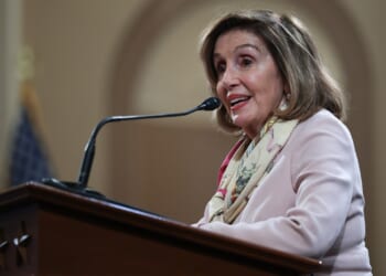 Nancy Pelosi at a podium