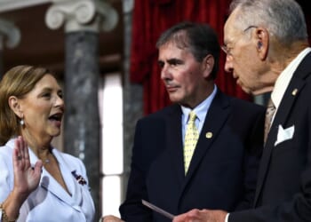 Sen. Darline Graham Nordone participates in a ceremonial swearing-in with Sen. Chuck Grassley as her husband Larry Nordone looks on in the Old Senate Chamber at the U.S. Capitol on July 14, 2026, in Washington, D.C.