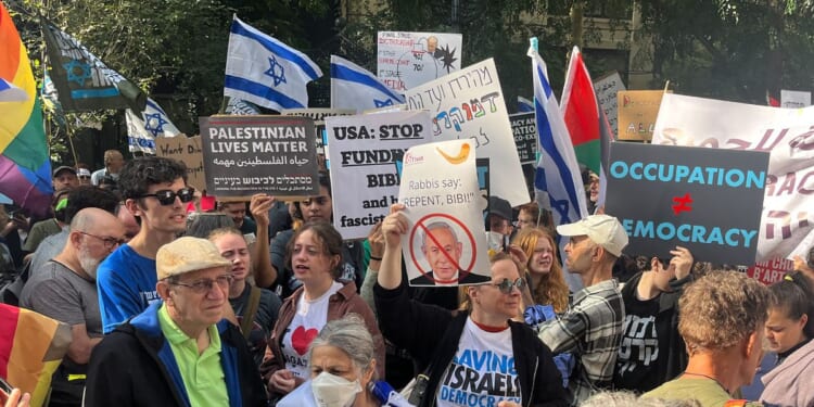 Anti-Israel demonstrators hold signs as Israeli Prime Minister Benjamin Netanyahu addresses the 78th UN General Assembly in New York on Sept. 22, 2023.
