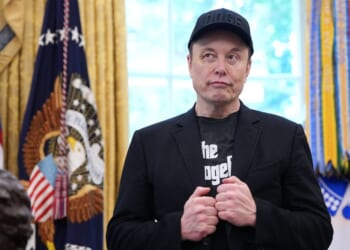 Tesla CEO Elon Musk listens as President Donald Trump speaks to reporters in the Oval Office of the White House on May 30, 2025, in Washington, D.C.