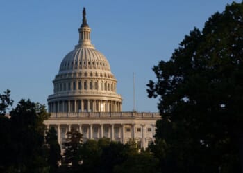 The afternoon sun shines on the United States Capitol in Washington, D.C.