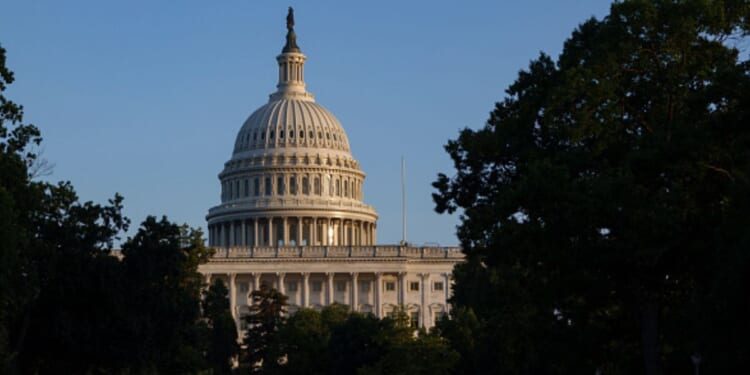 The afternoon sun shines on the United States Capitol in Washington, D.C.