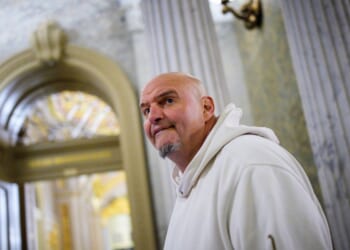 Sen. John Fetterman arrives for votes on Nov. 10, 2025, on Capitol Hill in Washington, D.C.