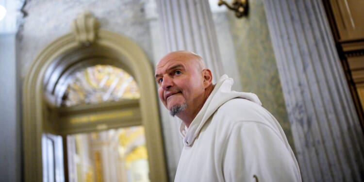 Sen. John Fetterman arrives for votes on Nov. 10, 2025, on Capitol Hill in Washington, D.C.
