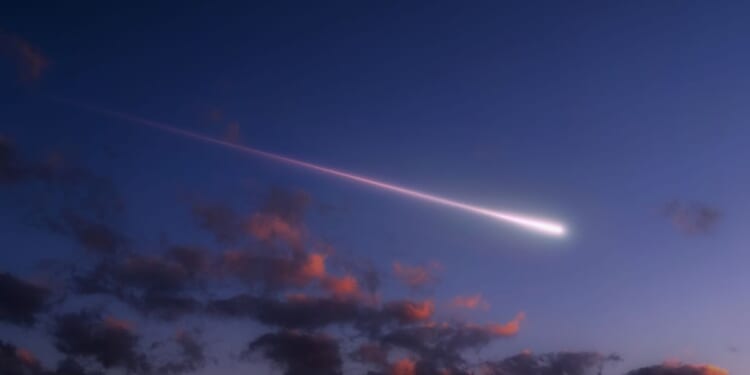 A bright shooting star above the clouds.